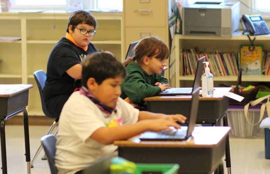 Third grade students work on ChromeBooks Thursday at Days Creek Charter School. But all students might be forced to learn from home if Covid-19 cases continue to increase in Douglas County.