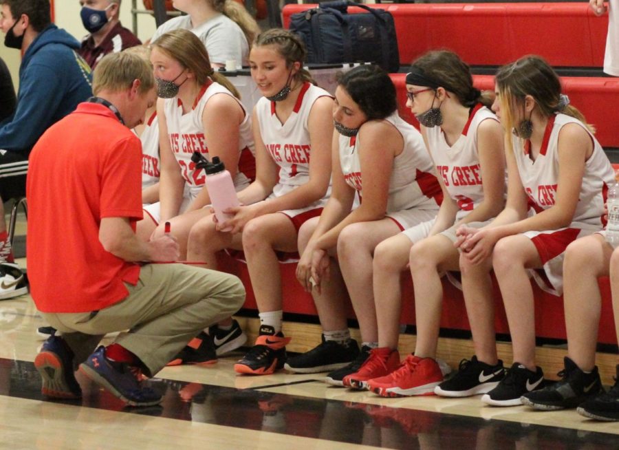 In this 2021 file photo, Travis Fuller draws up a play for the middle school girls basketball team last May. 