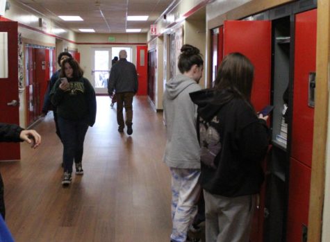 Days Creek students move between classes in the high school hall Tuesday. Earlier in the day, students were confined to their classes after a hoax triggered a lockout.