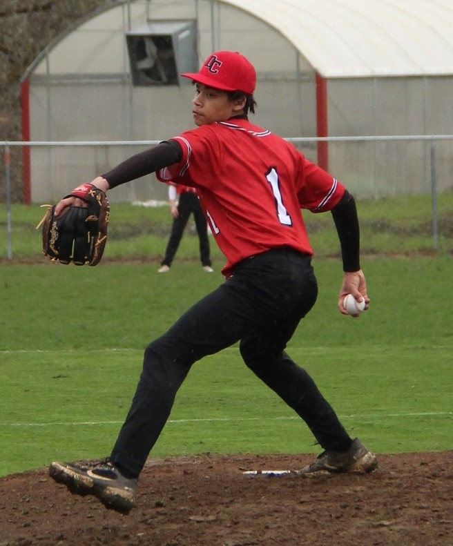 Freshman Xane Hopkins, pictured pitching against Oakland earlier this season, threw three innings of relief in Days Creeks 11-5 win over Camas Valley.