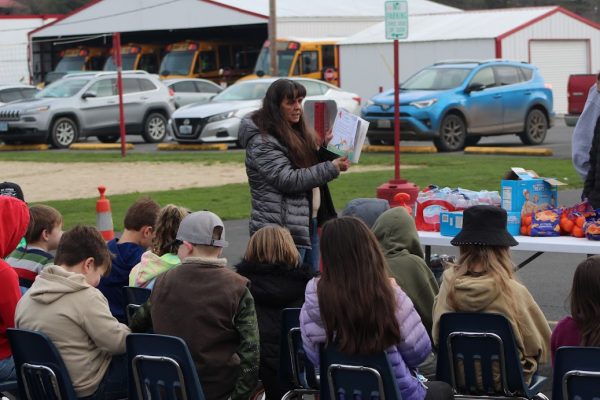 Leta Abel reads to students during a Rubber Boot Day.