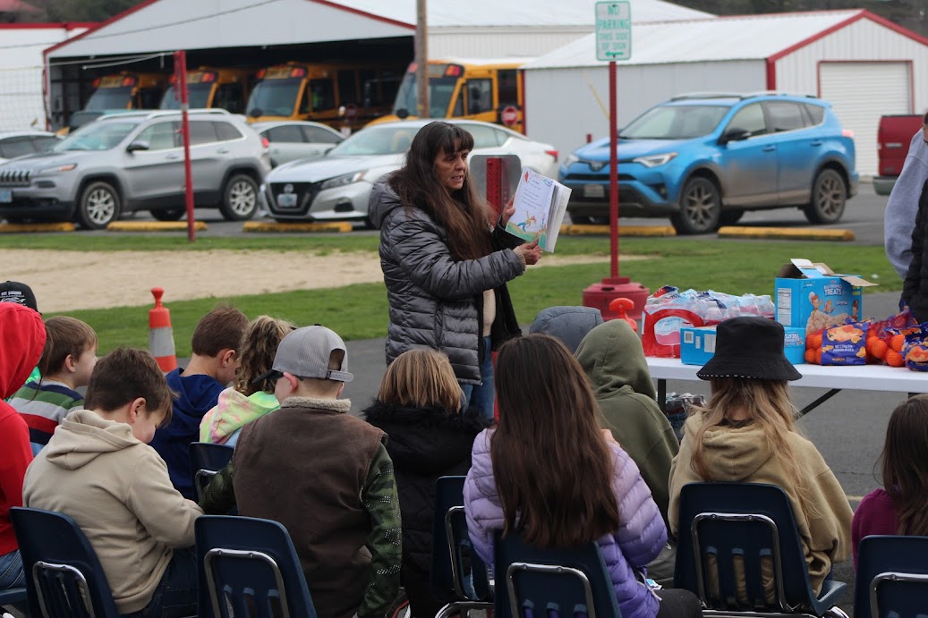 Leta Abel reads to students during a Rubber Boot Day.