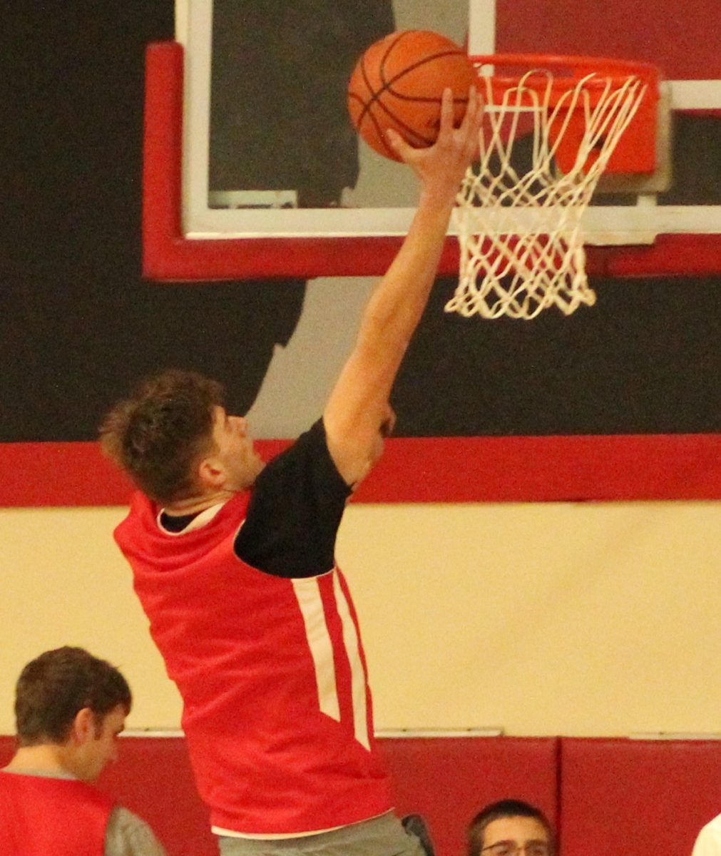 Senior Keegan Stufflebeam makes a layup during a recent practice. Stufflebeam is a returning all-league forward for the Wolves.