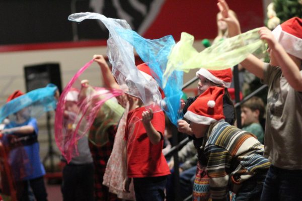 Days Creek elementary students perform a song during the winter program Wednesday.