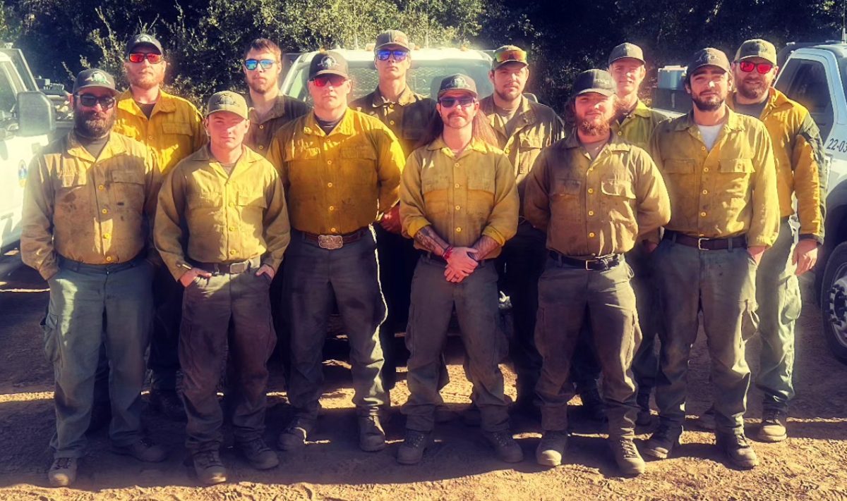 Firefighters assisting efforts to contain the Palisades Fire in California pose in this photo provided by the Douglas Forest Protective Agency. 