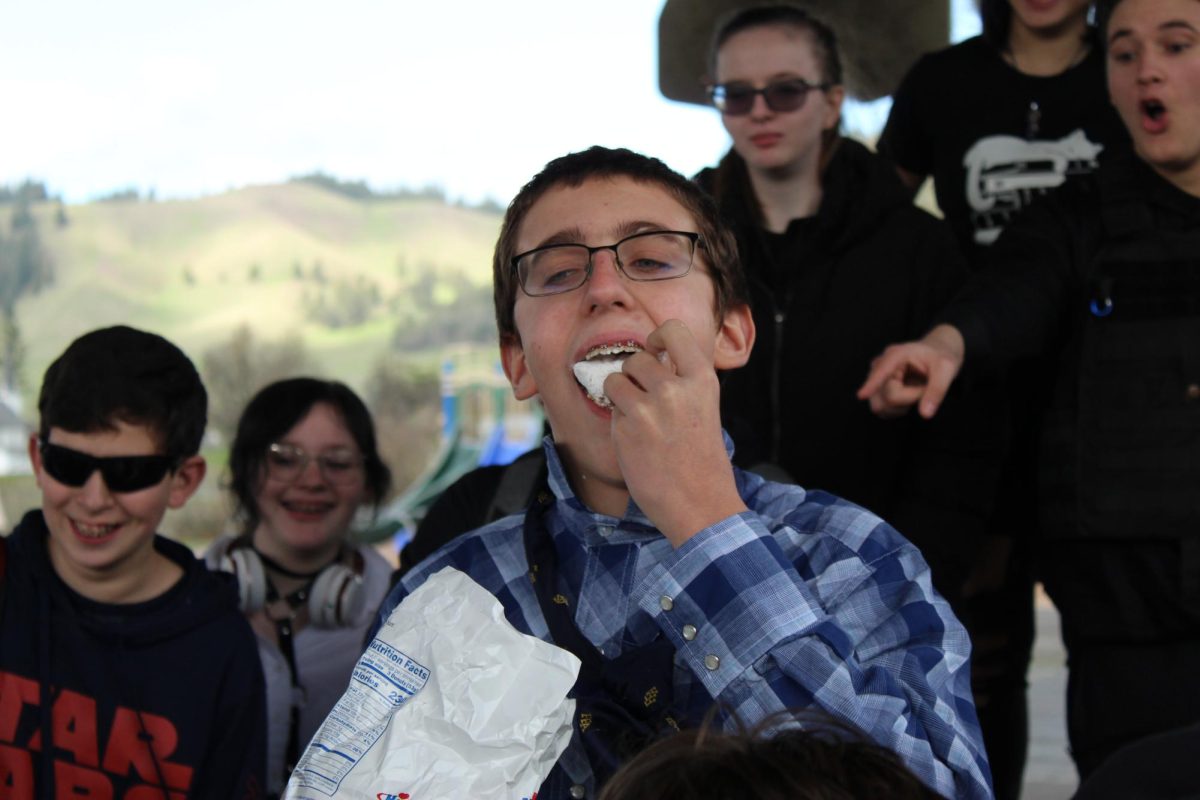 Sophomore Jeremy Poer eats donuts during a donut eating contest Tuesday during lunch.