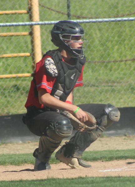 Camden Stufflebeam catches for Days Creek last season. The junior is a third-year player who will see time behind the plate and on the mound this season.